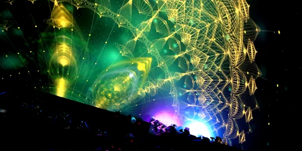 A big dome screen with abstract patterns projected onto it.