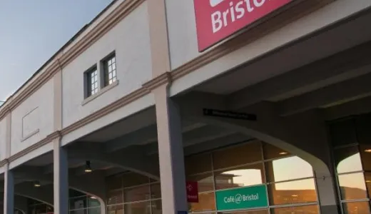 A white stone building with red logo reading 'At-Bristol' 