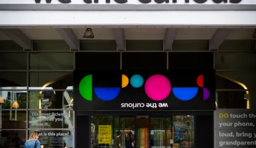 Entrance door to We The Curious, with name and colourful logo above the door