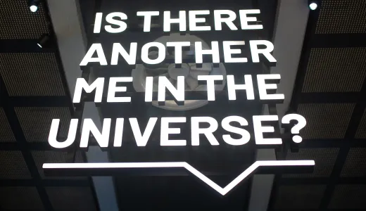 Illuminated sign reading 'Is there another me in the universe?'