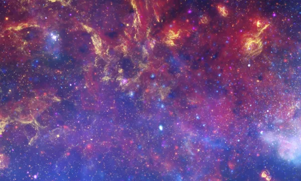 a matched trio of images of the central region of our Milky Way galaxy. Full of reds, yellows and blues.