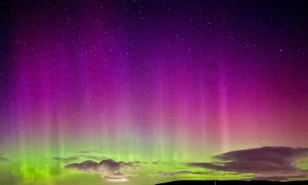 The Aurora Borealis, with pink and purples that fade into neon green.