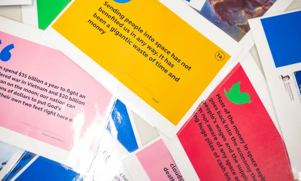 Colourful cards displaying a range of opinions on space exploration