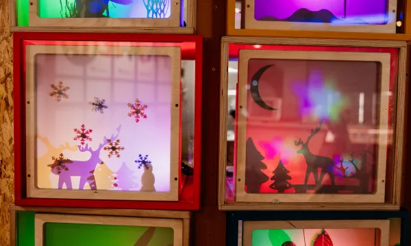 A selection of Christmas shadow boxes in the Tinkering Space in We The Curious. 