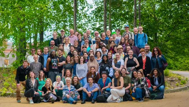 A large group of We The Curious staff posing for a photo outside