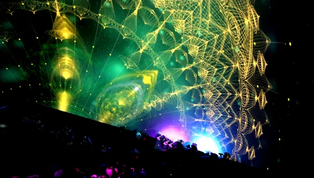 A big dome screen with abstract patterns projected onto it.