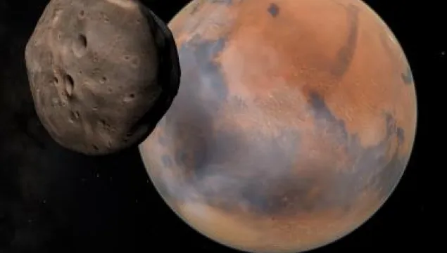 CG model of a small rocky moon passing in front of Mars