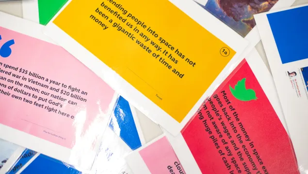 Colourful cards displaying a range of opinions on space exploration