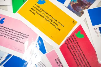 Colourful cards displaying a range of opinions on space exploration