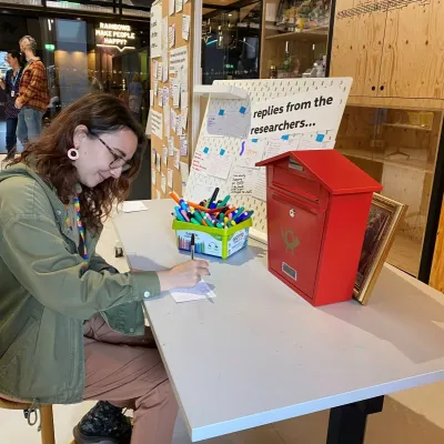 Writing postcards to researchers (photo credit: Joe Daly)