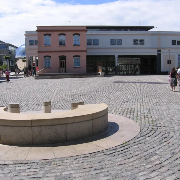 A large cobble-stoned, open space 