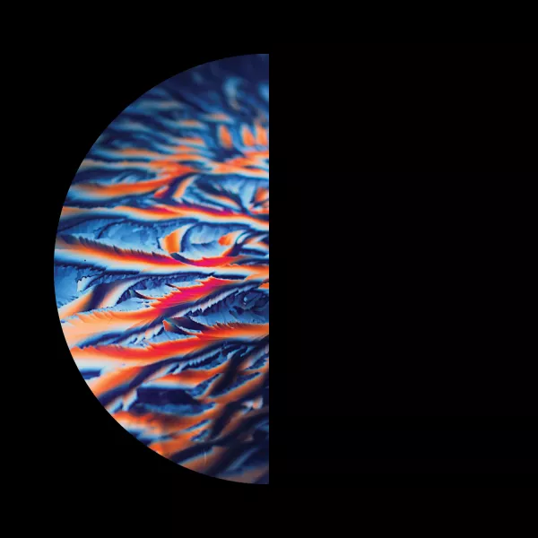 A semi-circle on a black background, featuring vibrant blue, orange, and red swirls 