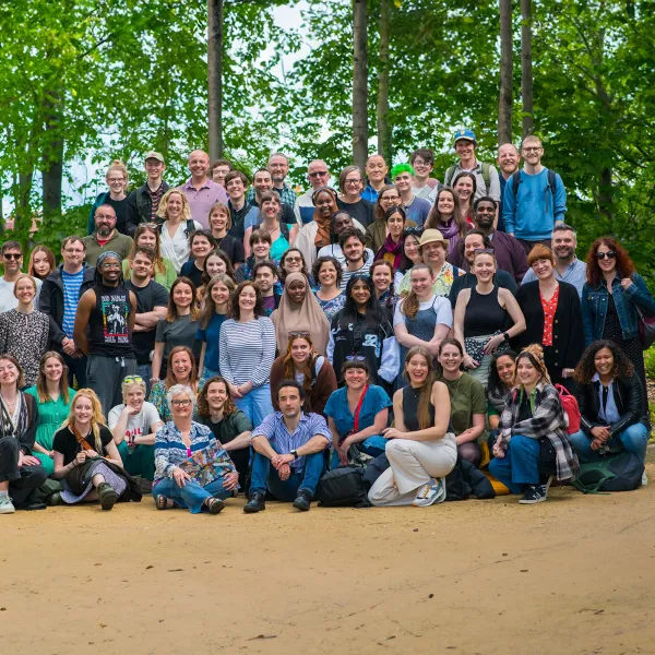 A large group of We The Curious staff posing for a photo outside